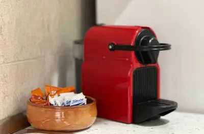 a red toaster sitting next to a bowl of food at MySweetHome near the Vatican in Rome