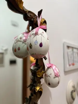 a group of ornaments hanging on a pole at Semini di nostalgia in Rome
