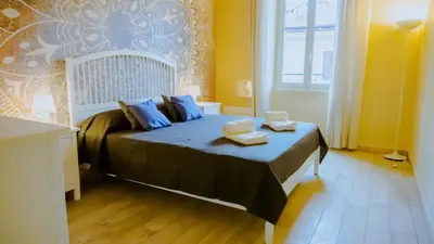a bedroom with a bed with two towels on it at Charme Retreat Boki in Rome