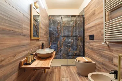 a bathroom with a bowl sink and a shower at Charming Trastevere One in Rome