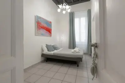 a bedroom with a bed in a room with a window at vatican apartment gianicolo in Rome