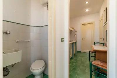 a bathroom with a toilet and a sink at GuestHost - Flaminio Apartment panoramic view with terrace in Rome