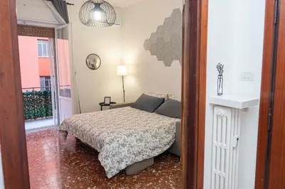 a small bedroom with a bed and a window at La casetta ai colli - Vicino alla Metro A in Rome