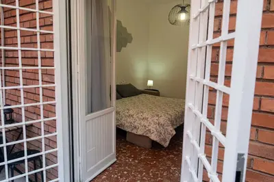 a room with a room with a bed and a room with atained at La casetta ai colli - Vicino alla Metro A in Rome