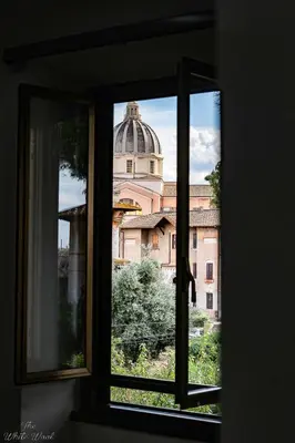 a view of a building through a window at The Little Big House in Rome