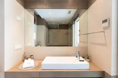 a bathroom with a white sink and a mirror at Lovely Cozy Nazionale 4 in Rome
