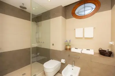 a bathroom with a toilet and a shower and a sink at Lovely Cozy Nazionale 4 in Rome