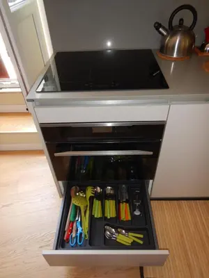 a drawer in a kitchen with tools in it at Barberini Bright Apartment in Rome