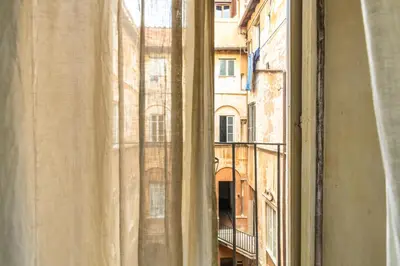 an open window with a view of a building at Suite Palazzo Bonaventura in Rome
