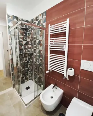 a bathroom with a shower and a toilet and a sink at Have a nice stay in Rome in Rome