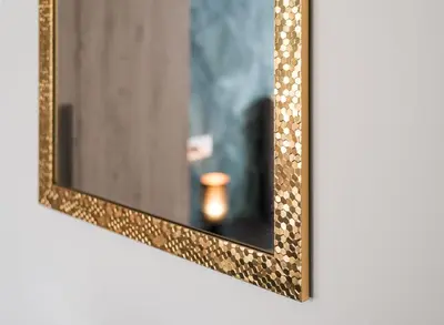 a mirror with a gold frame on a wall at Roma Design Rooms San Giovanni Colosseo Area in Rome