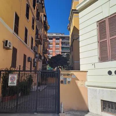 an entrance to a building with a black gate at Casa Minerva a Testaccio in Rome