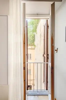 an open door to a balcony with a view of a building at Domus Paolina in Rome