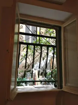 a window with a view of a building at Casina Roma, 2 min to Piazza Navona in Rome