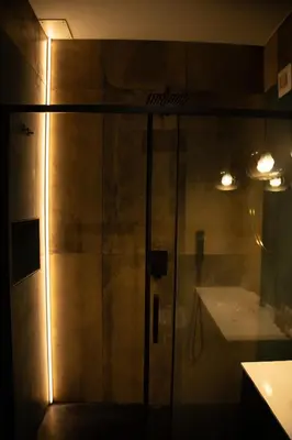 a shower with a glass door in a bathroom at Riad Campo de' Fiori in Rome
