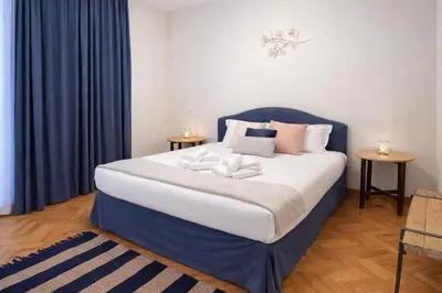 a bedroom with a bed with two towels on it at Peaceful apartment in piazza Venezia's alleys in Rome