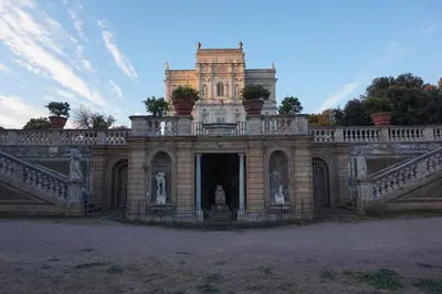 an old castle with a staircase and a building at Fabiola Holiday House in Rome