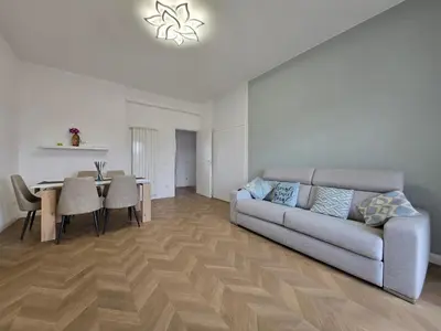 a living room with a couch and a table at Trastevere Dreamer Home Rome in Rome