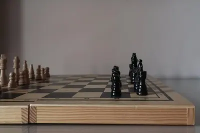 a wooden chess board with chess pieces on it at [Termini Treasure] - Elegant retreat in Rome