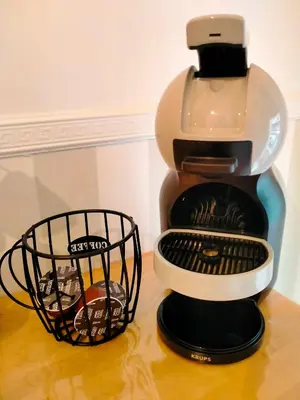 a coffee maker sitting on top of a table at The green place alloggio turistico in Rome