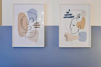 two pieces of art hanging on a wall at Elide - Nido d'amore in Ponte Milvio con Balcone in Rome