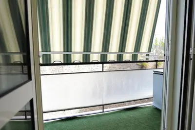 a view of a window with a blinds on a door at stazione trastevere\u516c\u5bd3 in Rome
