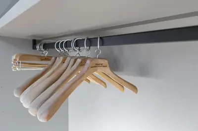 a group of wooden utensils hanging from a rack at MONTI44 Boutique Apartment in Rome