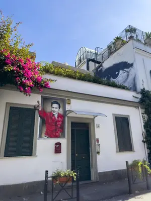 a painting of a man on the side of a building at Lovely Apartment in Hip and Vibrant Pigneto in Rome
