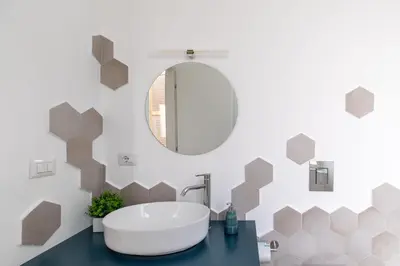 a bathroom with a tub and a mirror at iFlat Sunny & Brand New Apartament near Vatican in Rome