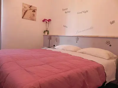 a bedroom with a bed with a red blanket at Vica Pota in Rome
