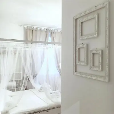a white bedroom with a window and a picture frame at VATICAN CITY 76 Apartment in Rome