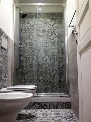 a bathroom with a shower with a toilet and a sink at VATICAN CITY 76 Apartment in Rome