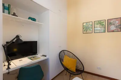 a living room with a desk and a chair at Amazing Campo de' Fiori in Rome