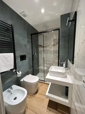 a bathroom with a sink and a mirror at Roma Nostra Luxury B&B in Rome