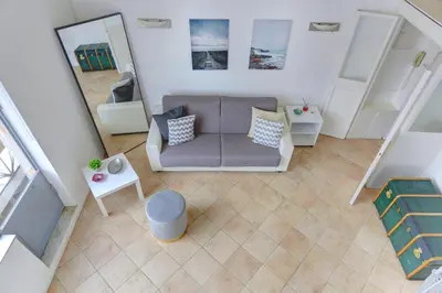 an overhead view of a living room with a couch at LOFT CAPOCCI 37 - Home and More in Rome