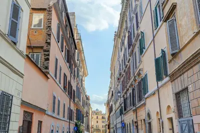 an alley in a city with tall buildings at LOFT CAPOCCI 37 - Home and More in Rome