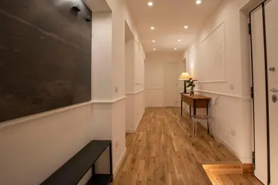 a hallway with a desk and a blackboard on the wall at Effe 9 Apartment - p.le Flaminio in Rome