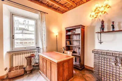 a home office with a desk and a window at Flat with Lovely Views near Piazza Navona in Rome