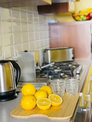 a bunch of lemons on a cutting board in a kitchen at Cozy apartment Gianicolense 3bdr in Rome