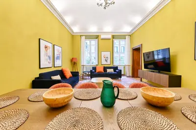 a living room with a table with bowls on it at Elegant oasis among the Vatican and Via del Corso in Rome