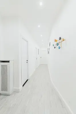 an empty room with white walls and white floors at Casa Boccea 112 in Rome