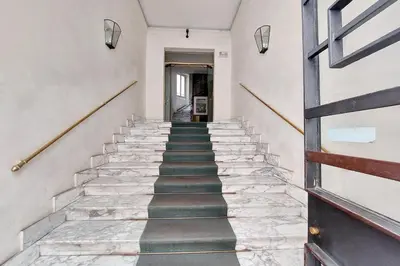 a staircase in a house with stone steps at 4BNB - Cimabue Apartment in Rome