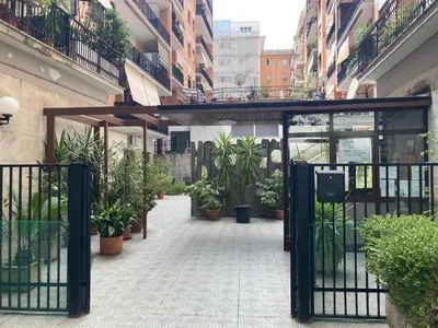 an entrance to a building with potted plants on it at Casa Caravella in Rome