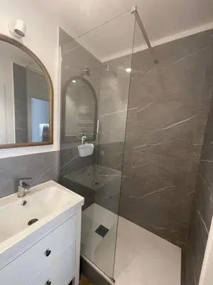 a bathroom with a shower and a sink at La casa di Jonathan al Ghetto in Rome