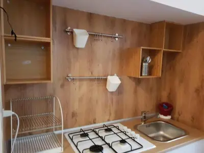 a kitchen with a sink and a stove at La casa di Marisela in Via Emanuele Filiberto in Rome