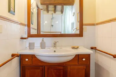 a bathroom with a sink and a mirror at Loft Colosseo, in Rome Center in Rome