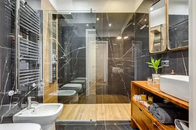 a bathroom with a sink toilet and a shower at Roma in relax lovely two room in the center of Rome, Fabrizia in Rome