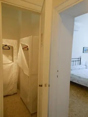 a room with a bedroom with a bed and a door at Romolo House in Rome