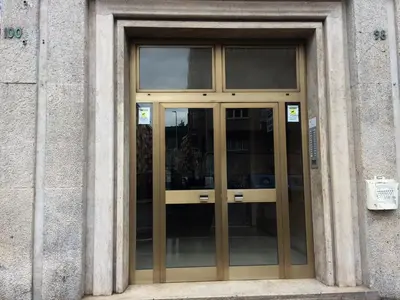a glass door of a building with a sign on it at Romolo House in Rome