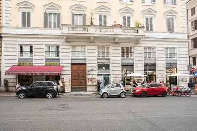 a building with cars parked in front of it at Chroma Italy - Chroma Octho in Rome